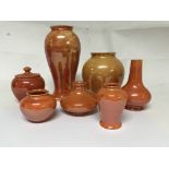 A collection of moorcroft orange lustre ware compr
