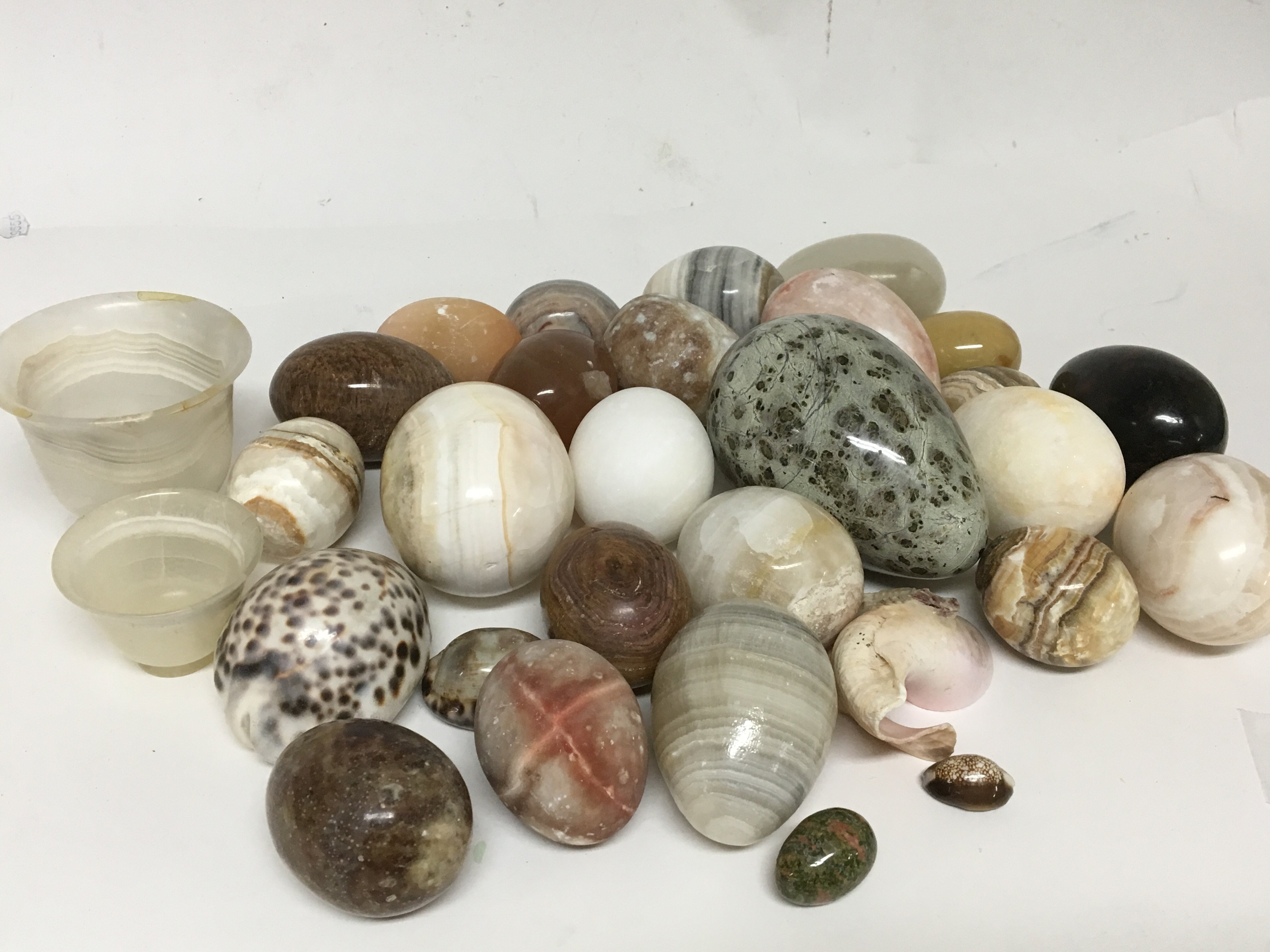 A collection of polished egg shaped stone and mine