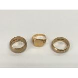 Three gold rings comprising one 18ct and two 9ct e
