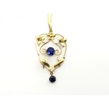 An Edwardian gold and sapphire pendant of naturali