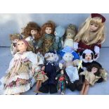 A box of Porcelaine dolls and others