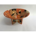 A Clarice cliff conical bowl decorated in orange c