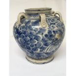 A crackle ware glazed and hand painted blue and wh