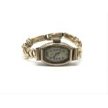 A ladies 9ct gold cased wristwatch with small dial