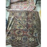 A hand knotted Afghan rug, approx 220cm x 320cm.