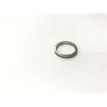 A platinum and dated diamond eternity ring. Weight