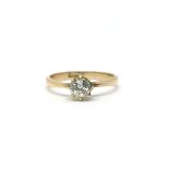 An 18ct gold ring inset with a single diamond. Tot