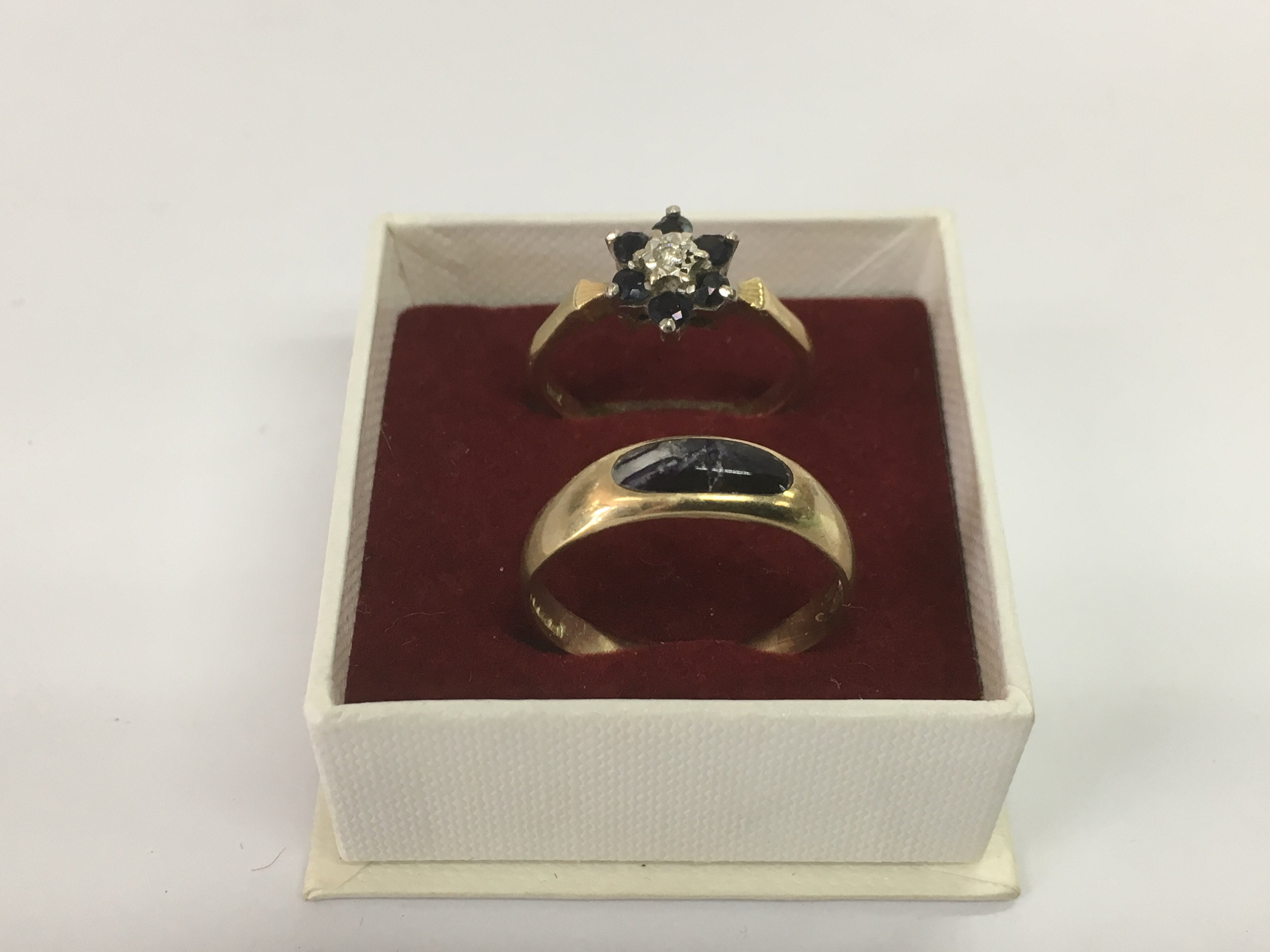 Two gold rings, one 18ct example set with stones a