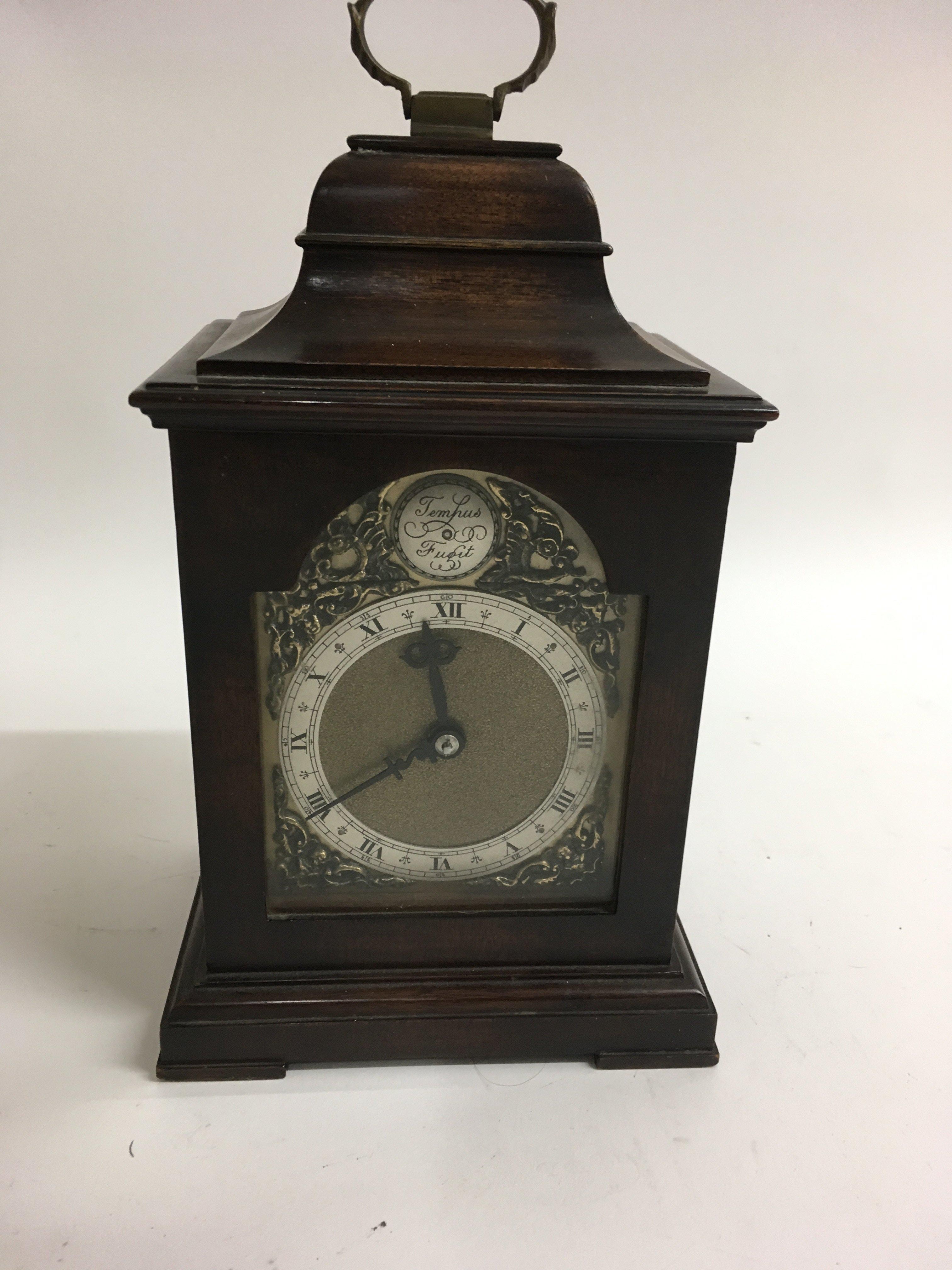 A mahogany case natal clock the brass dial with Ro