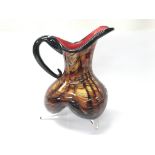 A Murano art glass jug with amber, black and red t