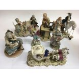 A collection of ceramic figure including a pair of