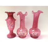 Three 19th century cranberry glass vases, all deco