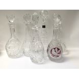 Six cut glass decanters including a Royal Doulton
