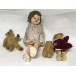 A large group of dolls and teddy bears, comprising