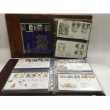 Four albums of first day covers.