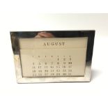 A silver plate Tiffany & Co calendar in Tiffany bo