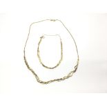 A 9ct gold necklace with twisted chain and conform