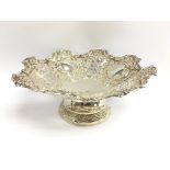 A silver pierced dish with floral decoration, hall