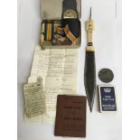 A collection of military items including WW1 Medals and Lusitana medallion and Dagger