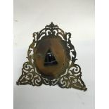 A small folding picture frame inset with a decorative agate moth motif.