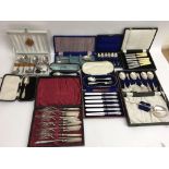 A collection of cased cutlery sets including a set