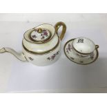 A Lowestoft tea set decorated with flowers and foi