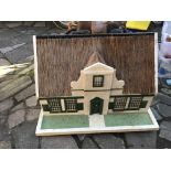 A Thatched cottage dolls house , access through th