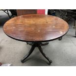 A 19th century single piece mahogany table top, with detached base. Top measures approx 94cm across,