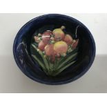 A moorcroft small dish decorated with African lily