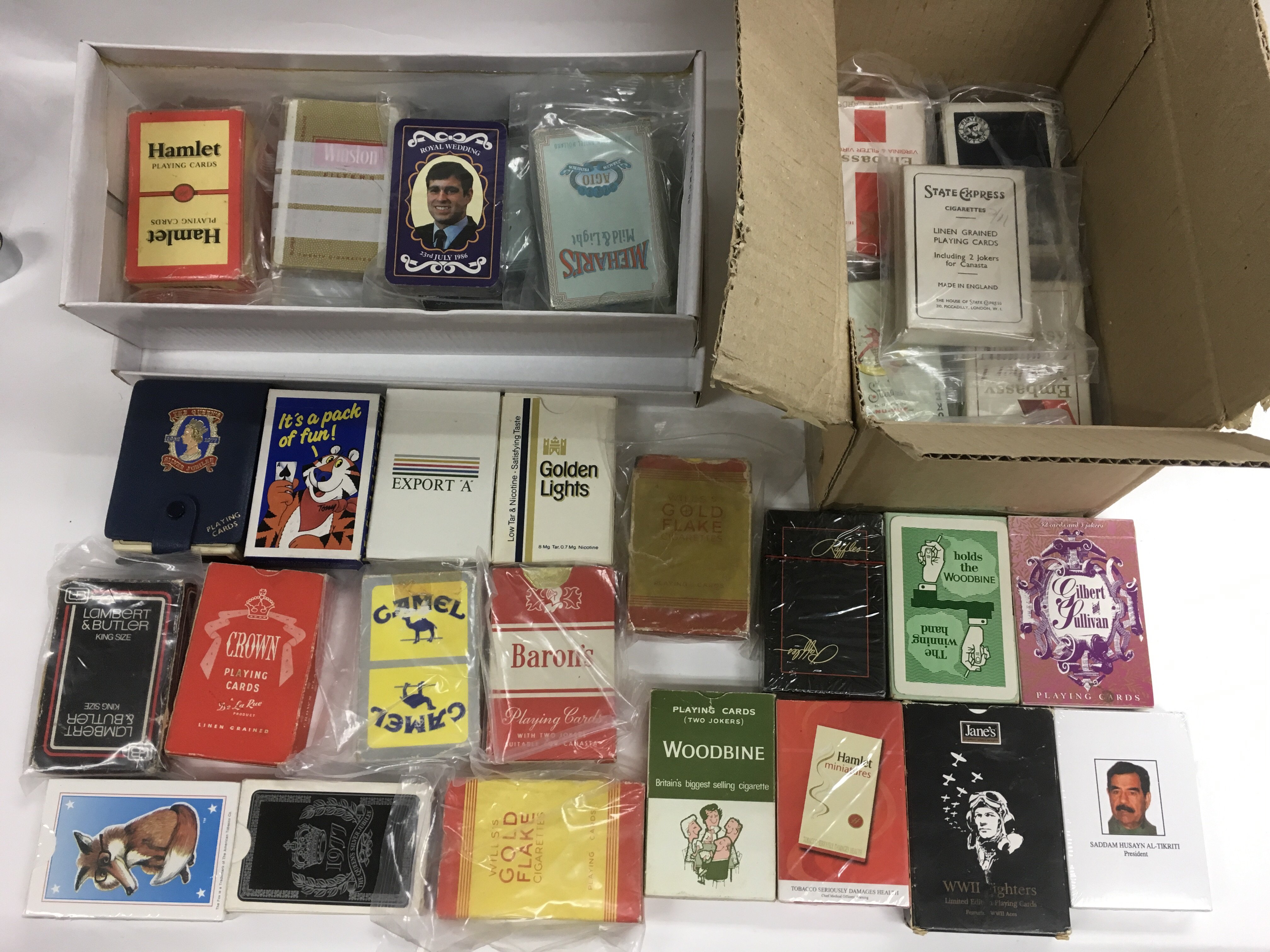 A collection of various playing cards, many sealed