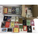 A collection of various playing cards, many sealed