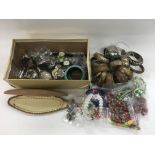 A box of costume jewellery including various bangl