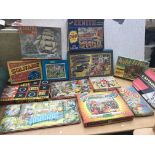 A collection of vintage boxed jigsaws and games al