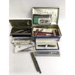 A small collection of pens including a Waterman Pa