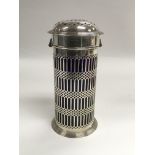 A silver sugar shaker with piercework decoration a