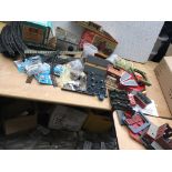 A box of OO gauge railway accessories including tr