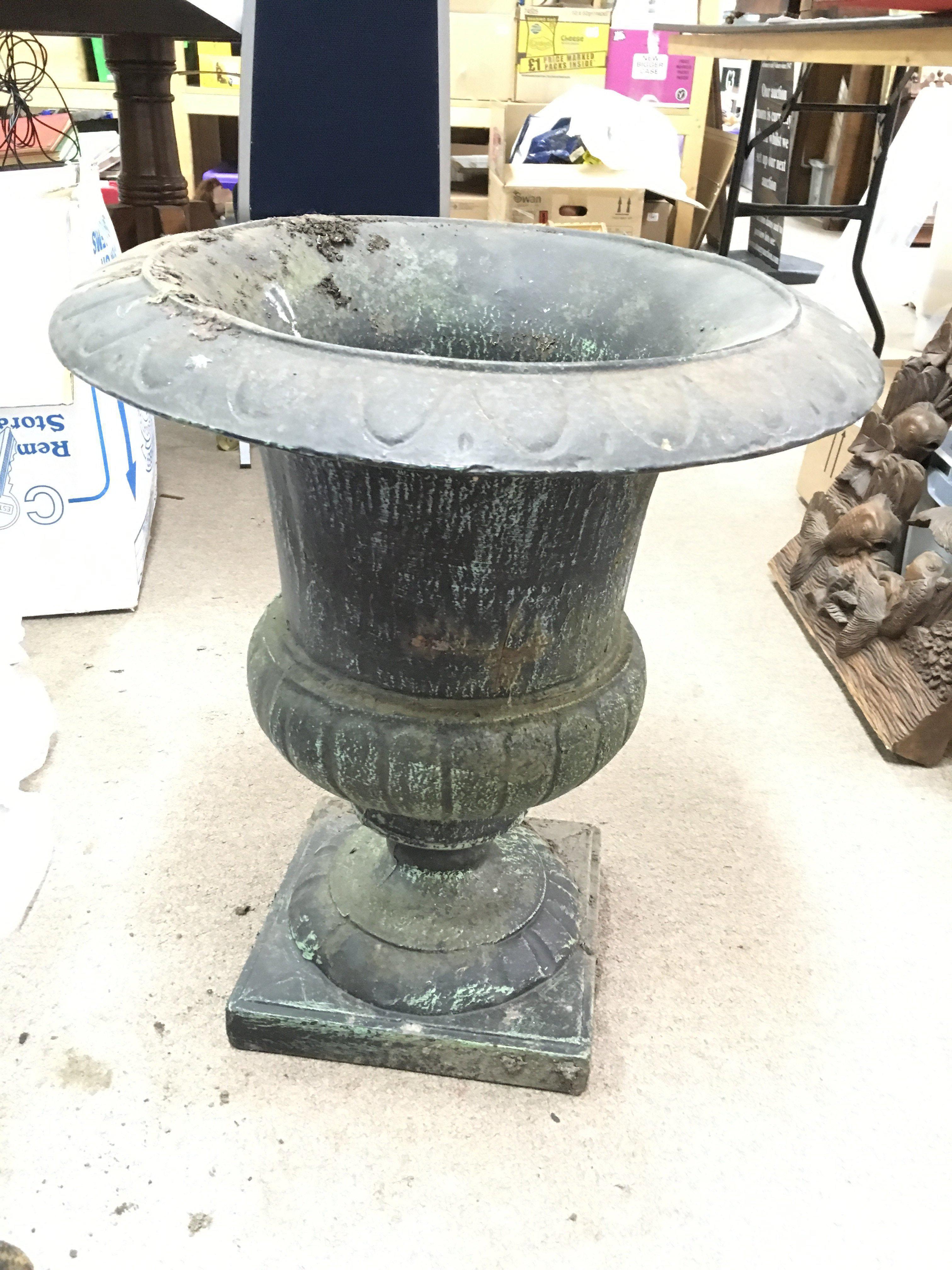 A large 19th century cast iron iron, approx 57cm tall x 52cm.