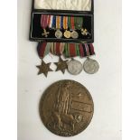 A death plaque a dress set of medals and a group o