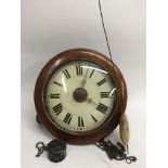 An antique oak cased wall clock with chain drop weights