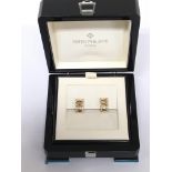 A Pair of Quality 18carat gold and brilliant cut diamond earings by Patek Philippe. With open