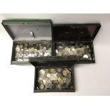 Three tins of mixed circulated world coinage.