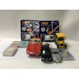 A collection of model cars playing cards and play