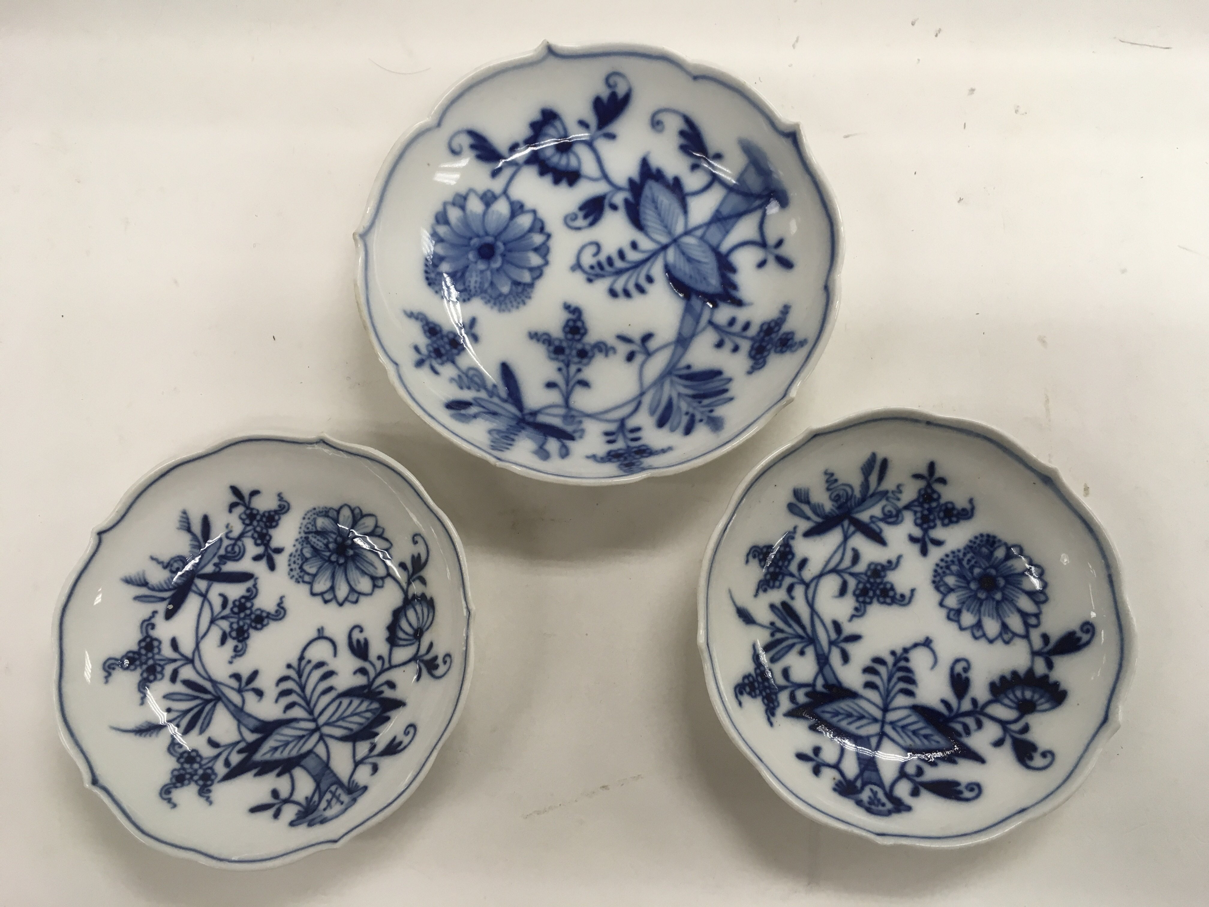 Three Meissen dishes, approx diameters 13cm and 10