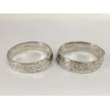 Two silver bangles.