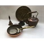 A collection of copper and brass ware including a bell and other oddments.