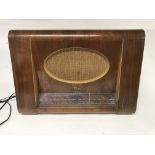 A vintage His Masters Voice wood cased Radio.