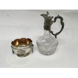 A Silver plated claret jug with scroll decoration