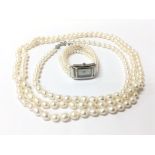 A mock pearl long necklace, a smaller conforming n