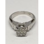 A white gold, square cut ring set with diamonds.Ap