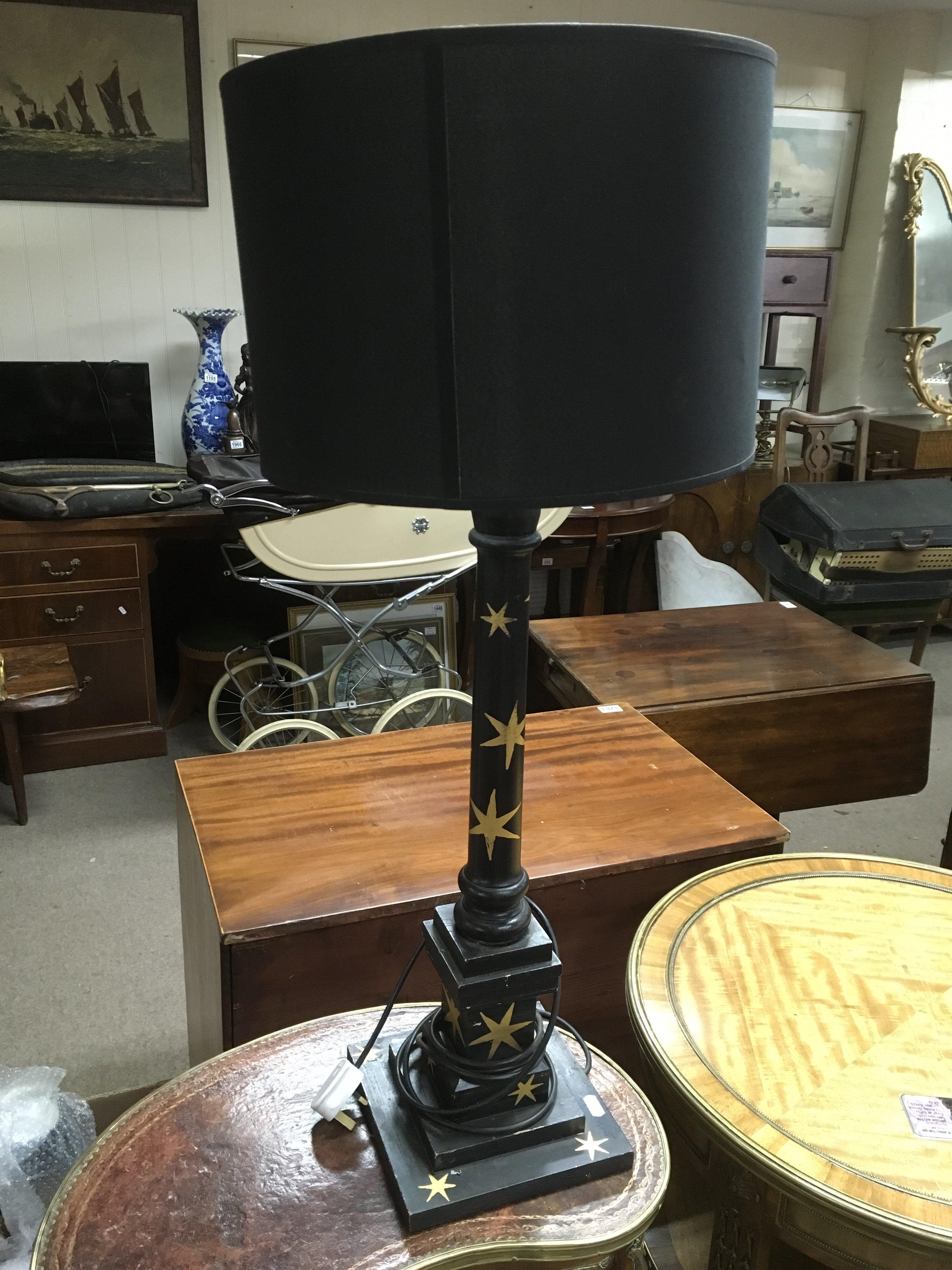 A Regency style table lamp painted black and iverl